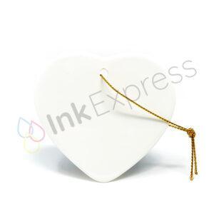 Sublimation ceramic hanging heart decoration, perfect for customising with unique designs. This versatile piece is part of our Christmas sublimation blanks collection and serves as an ideal ceramic sublimation ornament for creating personalised Christmas decorations and memorable gifts.