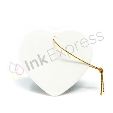 Sublimation ceramic hanging heart decoration, perfect for customising with unique designs. This versatile piece is part of our Christmas sublimation blanks collection and serves as an ideal ceramic sublimation ornament for creating personalised Christmas decorations and memorable gifts.